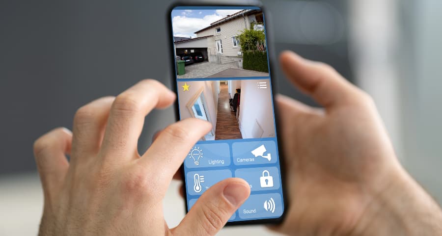 Person looking at surveillance camera footage on a smartphone